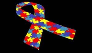 The image shows the autism jigsaw ribbon.