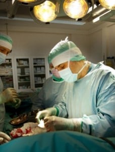 The image shows lead researcher Paolo Macciarini performing surgery.