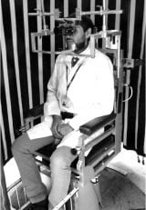 The image shows a participant sitting in the motorized chair, as described in the article.