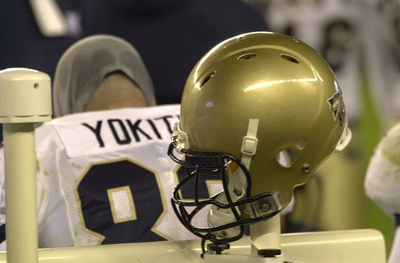 The image shows a football helmet designed to minimize concussion risks.