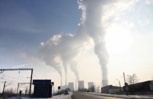 The image shows smoke stacks burning off coal.