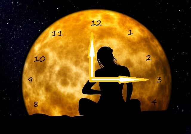 The badly adapted image is credited to neuroscience news and shows a woman meditating under a clock moon...the clock, we adapted.