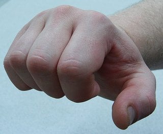 This image shows a fist about to throw a punch.