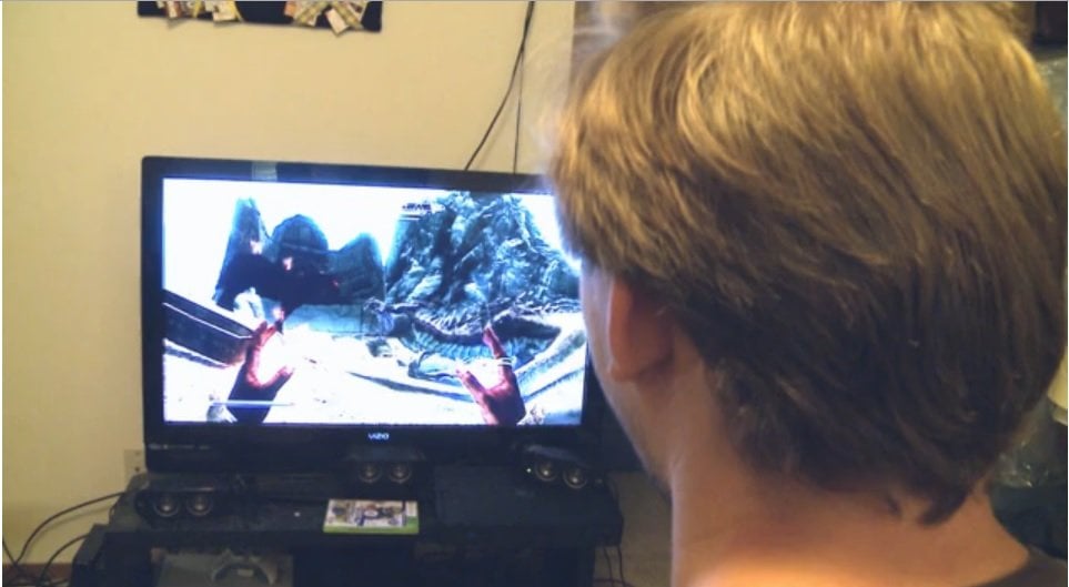 The image shows a person playing a video game.