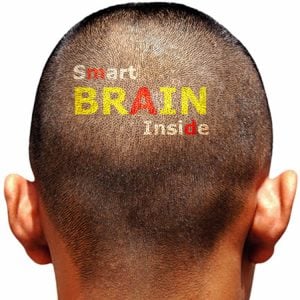 The image shows the back of a male's head with the word smart brain inside imprinted on the hairline.