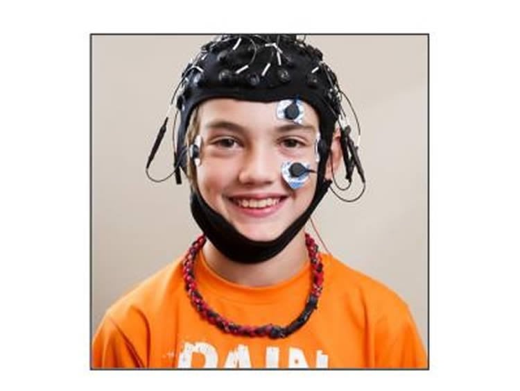 This image shows a child with the EEG headset on.
