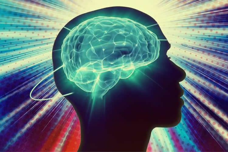 The image shows the outline of a head with a bright blue brain and lights in the background.