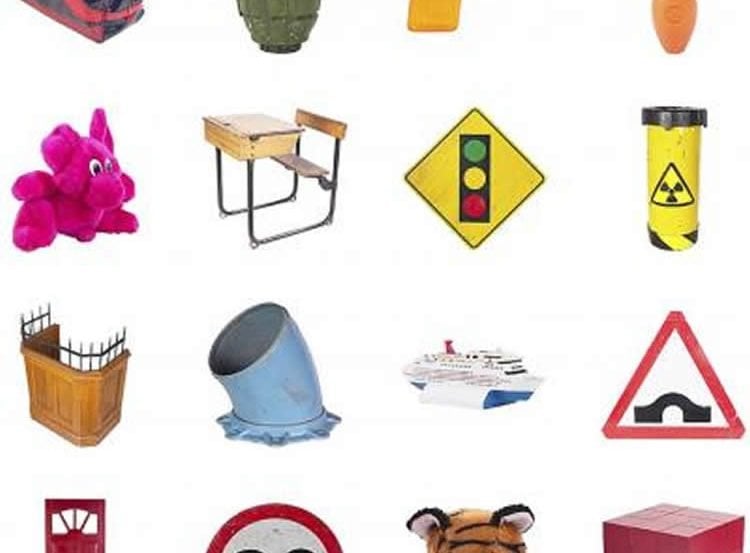 This image shows different items, such as a stuffed toy, desk and traffic sign.