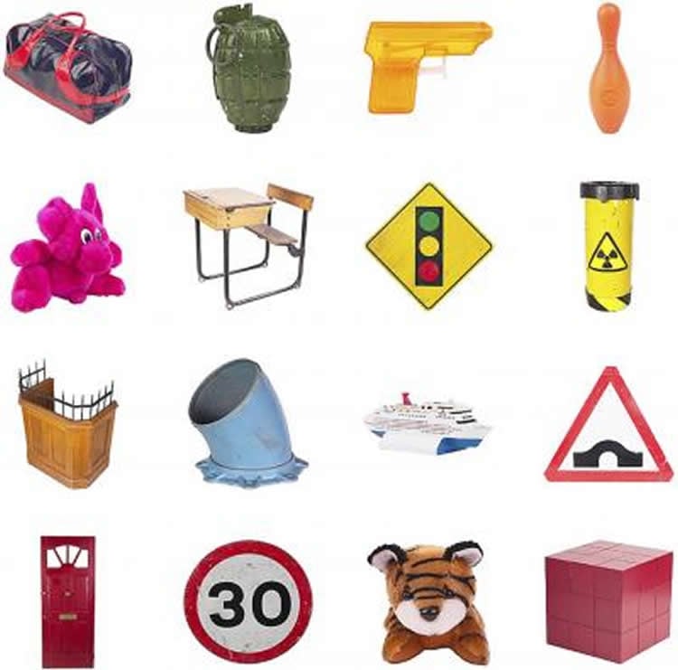 This image shows different items, such as a stuffed toy, desk and traffic sign.