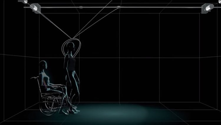 This image is a still from the video showing a 3d rendering of a person standing up from a wheelchair.