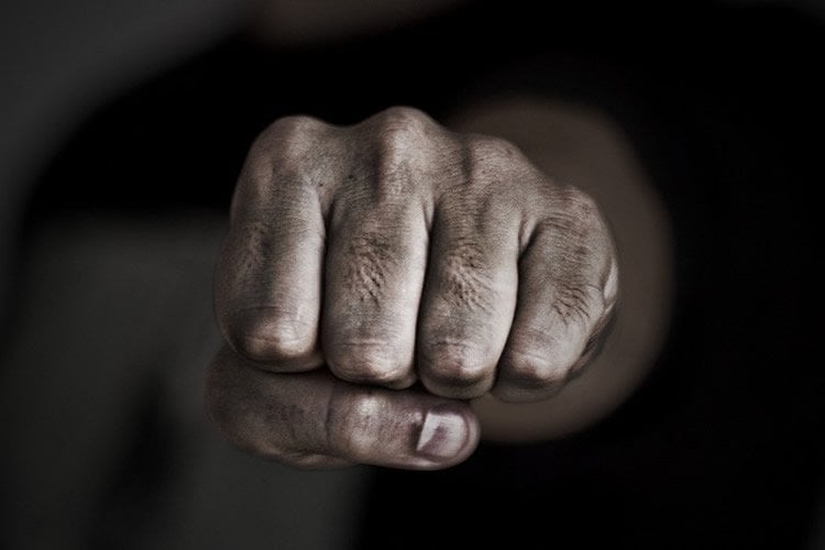 The image shows a man's fist.