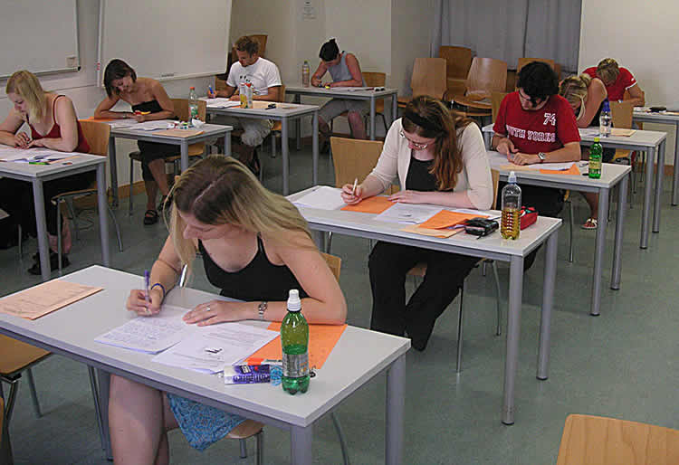 This image shows people taking an exam at school.