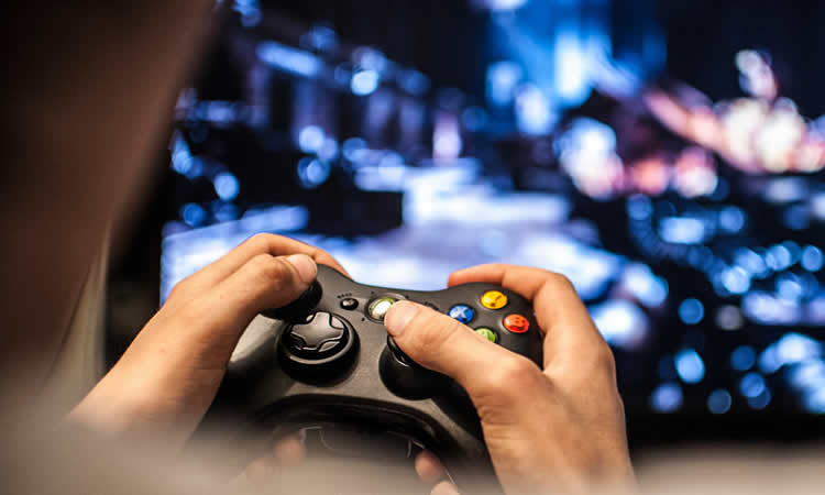 This image shows a person holding a video game controller.