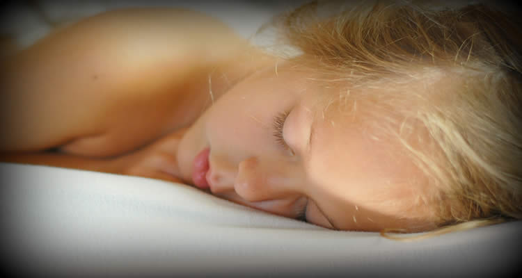 The image shows a young adult female sleeping.
