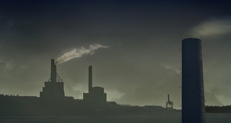 This image shows industrial smoke stacks pumping out smoke into the air.