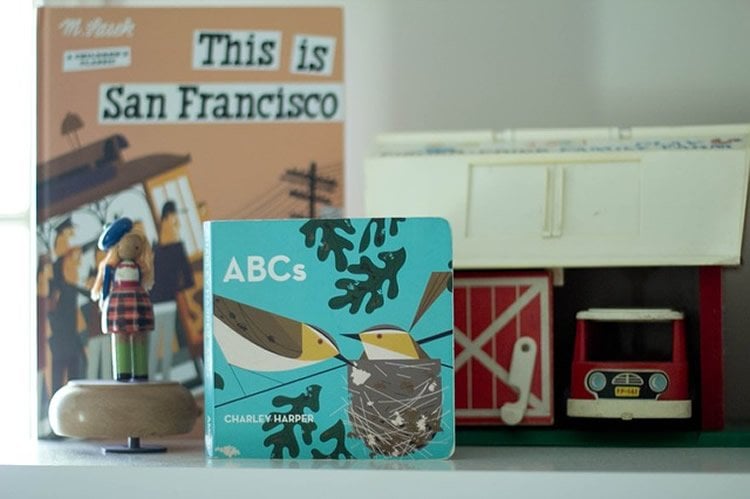 This image shows children's books and a toy truck.