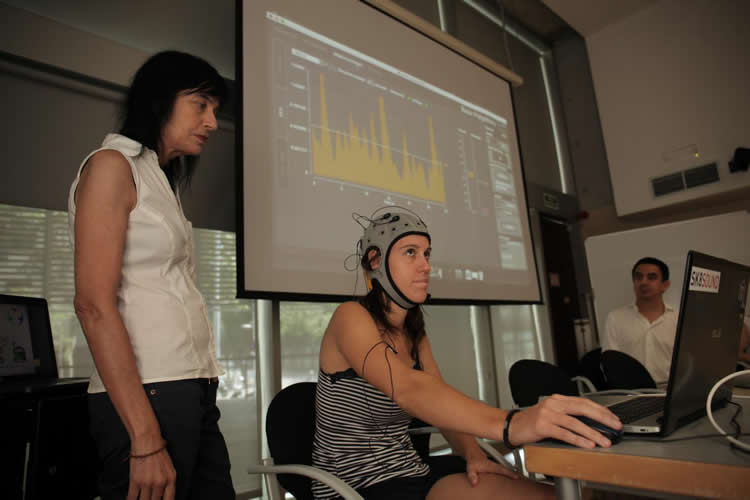 This image shows a woman wearing the EEG.