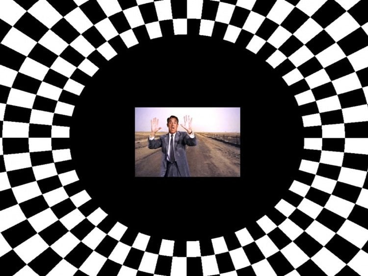 This image shows a clip from a movie surrounded by a checker board design.