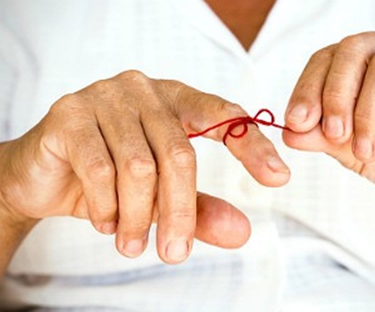 This shows a red ribbon tied around a person's figure.