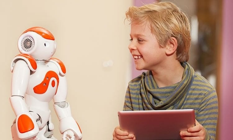 Photo of a small boy with the robot.