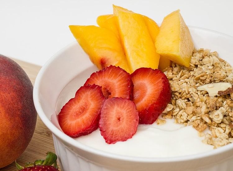 Image shows a bowl of yogurt and fruit.