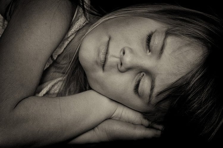 Image shows a girl sleeping.
