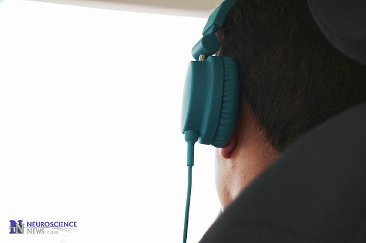 Image of a man with headphones on.