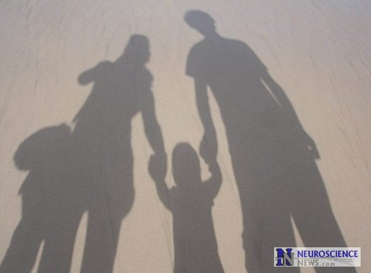 Image shows a family in shadows.