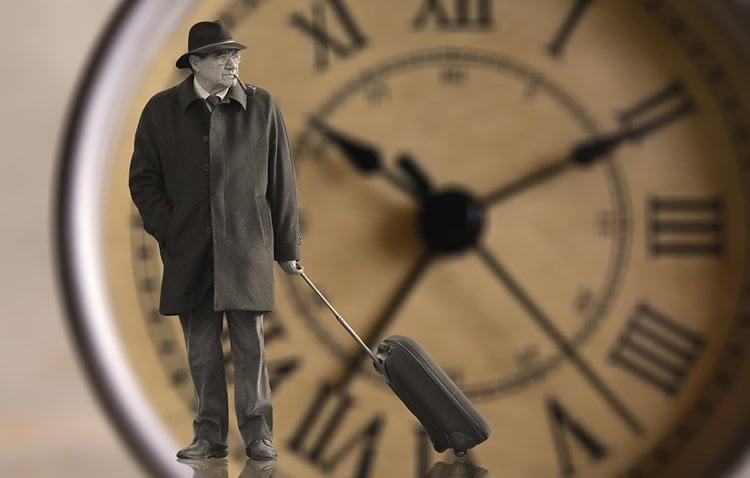 Image shows an old man and a clock.
