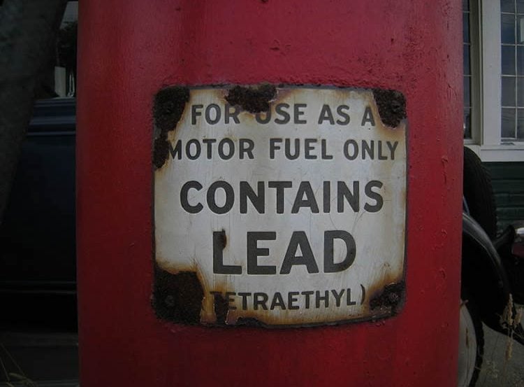 Image shows a sign warning of lead contamination.