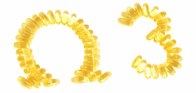 Image shows Omega 3 spelled out with vitamin capsules.