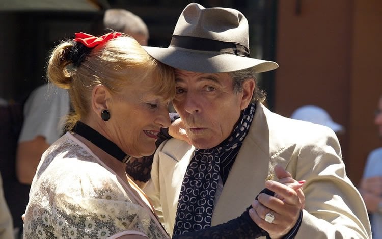 Image shows an older couple dancing.