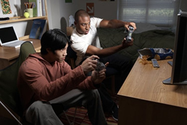 Image shows people playing video games.