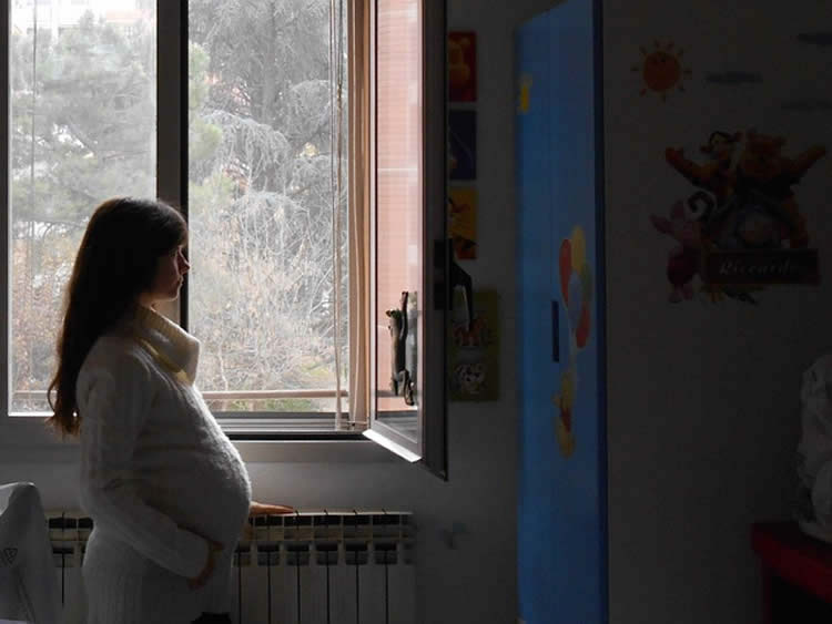 Image shows a pregnant woman.