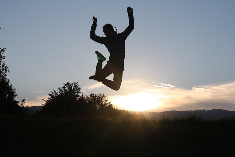 Image shows a person jumping and having fun.