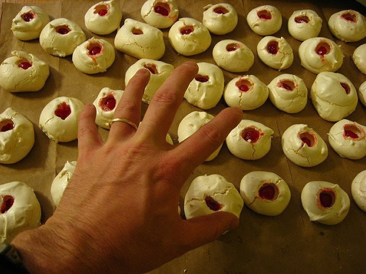 Image shows a person reaching for cookies.