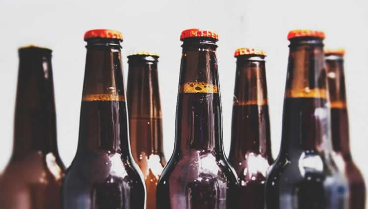 Image shows beer bottles.