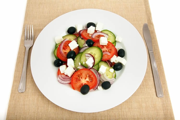 Image shows a plate of med style salad.