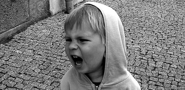 Image shows a screaming child.