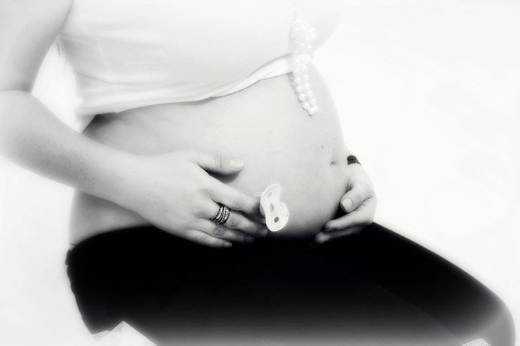 Image shows a pregnant woman.
