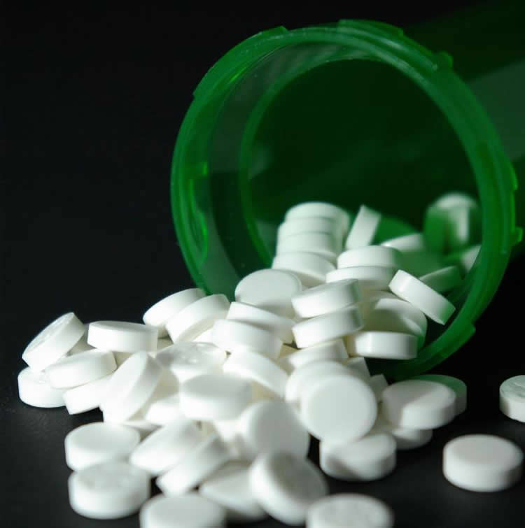 Image shows a bottle of pills.
