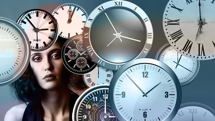 Image shows a woman and clocks.