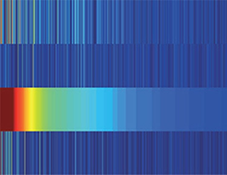 Image shows a rainbow against a blue background.