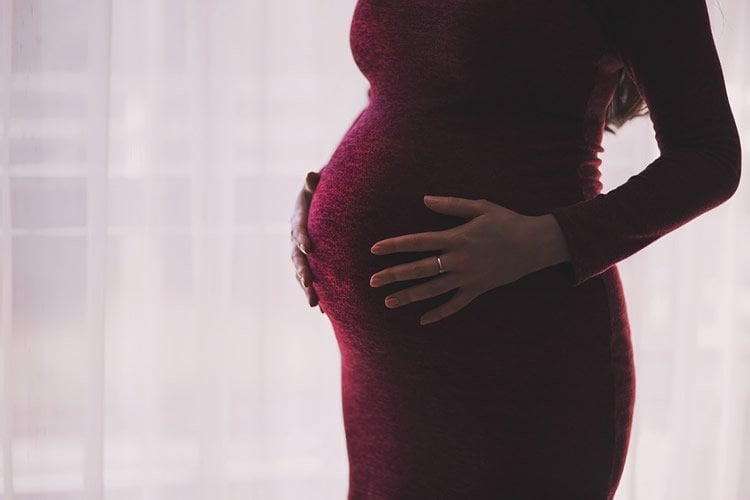 Image shows a pregnant woman.