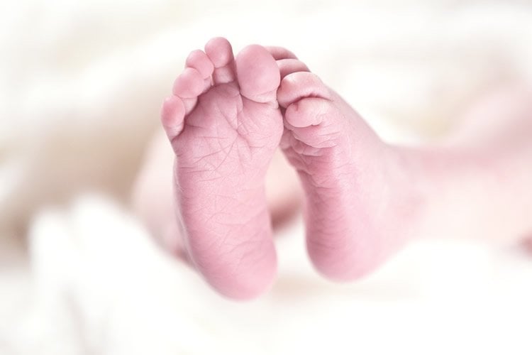 Image shows a baby's feet.