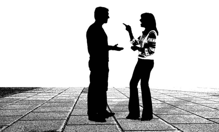 Image shows a couple talking.