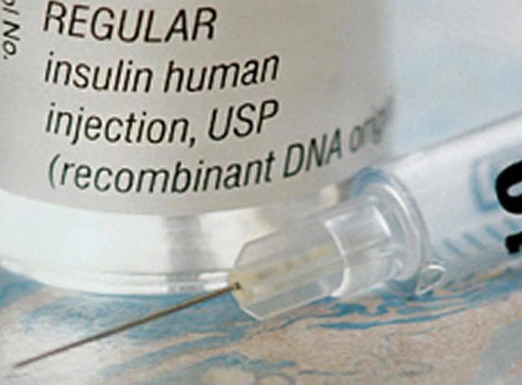 Image shows an Insulin bottle and needle.