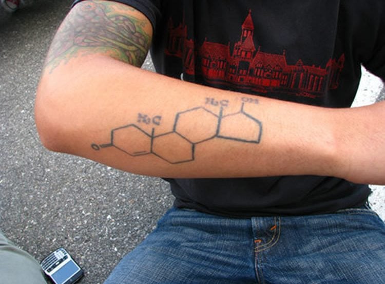 Image shows a man with the testosterone molecular structure tattooed on his arm.