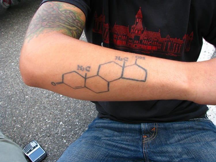 Image shows a man with the testosterone molecular structure tattooed on his arm.