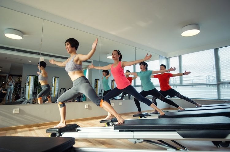 Image shows women doing yoga.